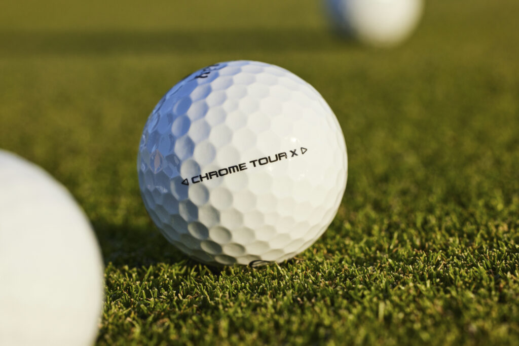 Callaway Golf Chrome Tour X Golf Ball lying in grass