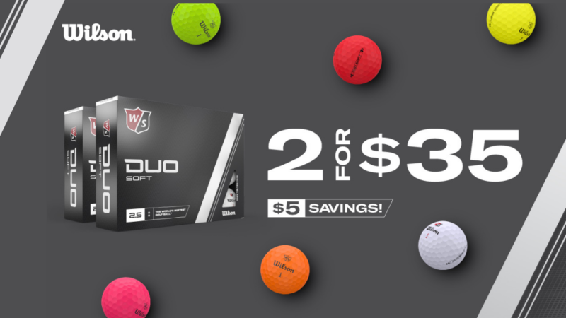 Wilson Duo Boxes and pink, yellow, red, orange, green golf balls on grey background.