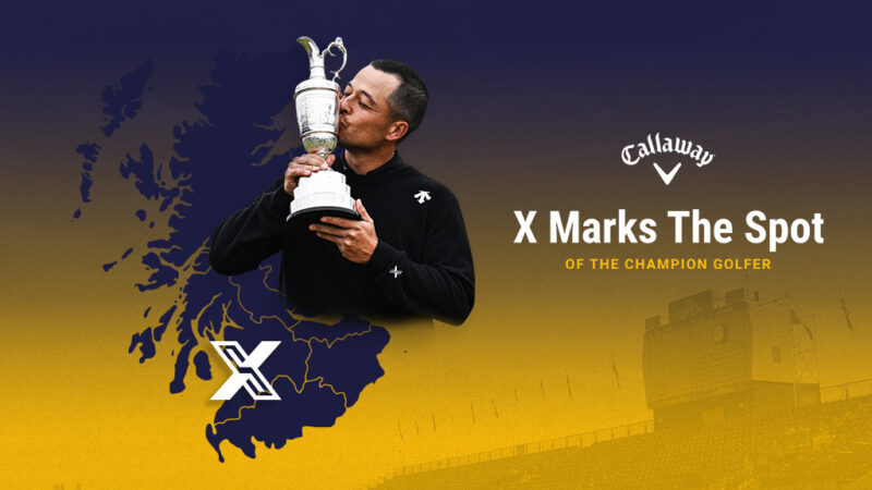 Xander Schauffele kissing trophy on yellow and blue background