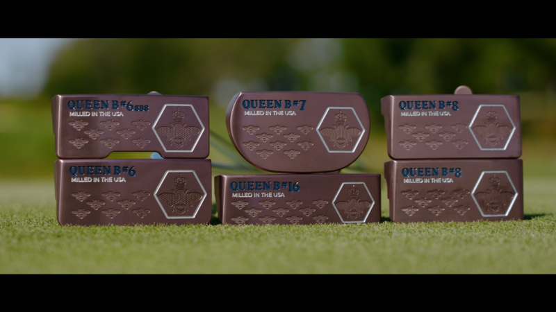 Six Copper Putters on Grass