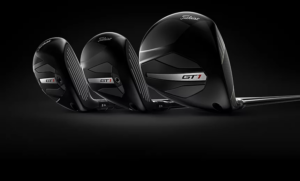 Black Driver, Fairway and Hybrid clubs on black background