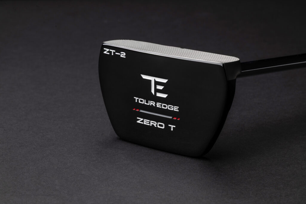 Close-up product image of the Tour Edge Zero T ZT-2 putter featuring a compact black mallet design with zero torque technology against a dark studio background.